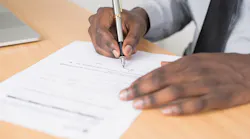 rsz_person-holding-gray-twist-pen-and-white-printer-paper-on-955389