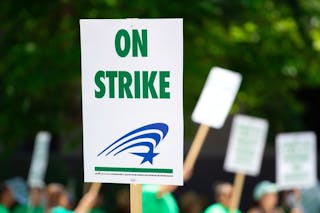 people-rallying-carrying-on-strike-signage-1094323-(2)