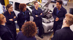 A team of auto techs meets for group learning.