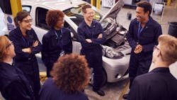 A team of auto techs meets for group learning. A team of auto techs meets for group learning.