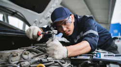 Technician under the hood