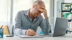 Man dealing with work-related stress.