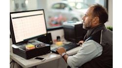 An auto repair shop owner looks at this computer. Understanding your shop&apos;s numbers can help you know what&apos;s best for your business and your customers.