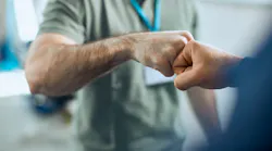 An owner and advisor exchange a fist bump. For shop owners, ensuring that top performers are happy and fulfilled is important to the success of the whole shop.
