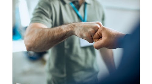 An owner and advisor exchange a fist bump. For shop owners, ensuring that top performers are happy and fulfilled is important to the success of the whole shop.