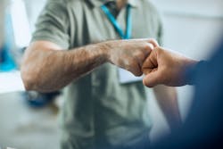 An owner and advisor exchange a fist bump. For shop owners, ensuring that top performers are happy and fulfilled is important to the success of the whole shop. An owner and advisor exchange a fist bump. For shop owners, ensuring that top performers are happy and fulfilled is important to the success of the whole shop.