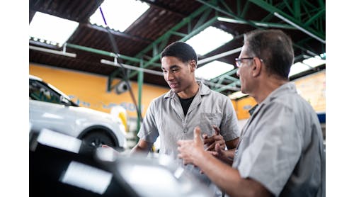 A young technician works with an older technician. As shops modernize, it&apos;s important for shop owners and older team members to embrace and train next-generation techs.