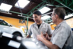 A young technician works with an older technician. As shops modernize, it's important for shop owners and older team members to embrace and train next-generation techs. A young technician works with an older technician. As shops modernize, it's important for shop owners and older team members to embrace and train next-generation techs.