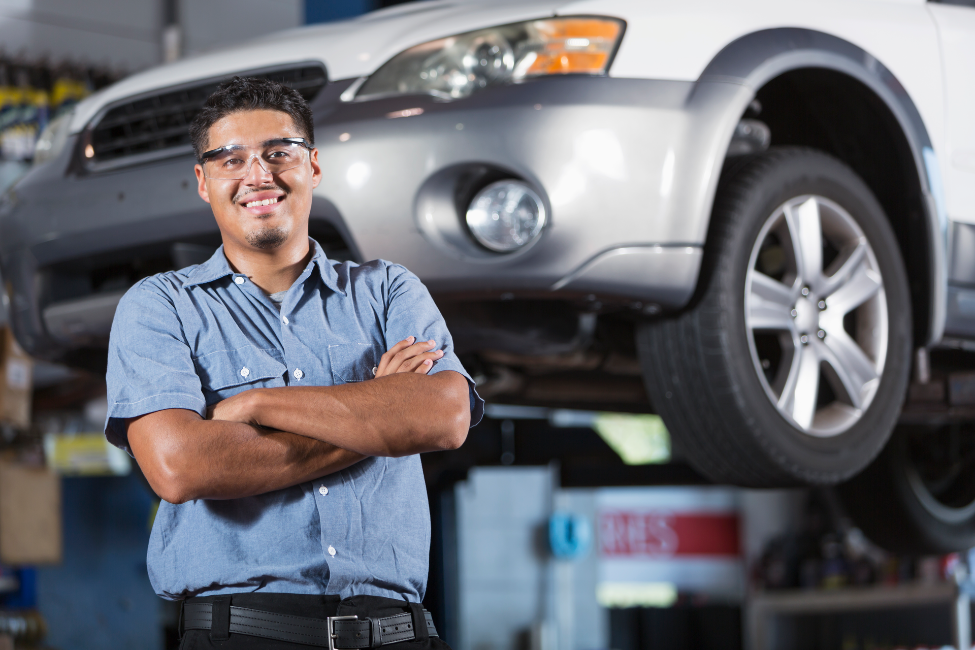 An auto technician stands in a shop. According to the 2023 Ratchet+Wrench Industry Survey Report, more technicians are becoming shop owners in 2023.