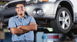 An auto technician stands in a shop. According to the 2023 Ratchet+Wrench Industry Survey Report, more technicians are becoming shop owners in 2023.