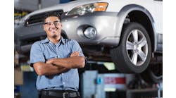 An auto technician stands in a shop. According to the 2023 Ratchet+Wrench Industry Survey Report, more technicians are becoming shop owners in 2023.