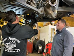 Trey Magee looks on as he talks to an auto technician at Kessler Automotive, a transmission shop in Toano, Virginia. Trey Magee looks on as he talks to an auto technician at Kessler Automotive, a transmission shop in Toano, Virginia.