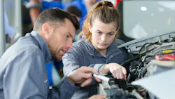 Student trains on a car.