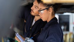 An automotive tech student learns on the job. An automotive tech student learns on the job.