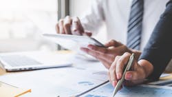 Business partners look at the business data. Business partners look at the business data.