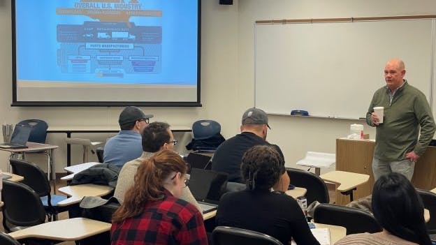 Bill Hanvey, president and CEO, Auto Care Association (pictured on the right), teaches an automotive aftermarket course during a recent visit to Northwood University in Midland, Michigan.