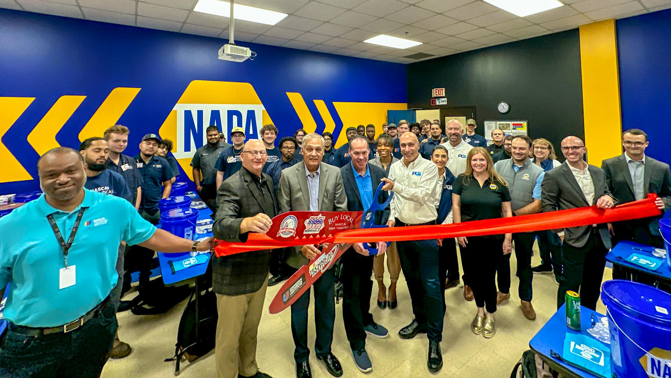 NAPA, PGI, and UTI Teams at the NASCAR Technical Institute to commemorate the completion of 13 NAPA Gold branded classrooms.