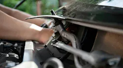 working_on_engine_underhood