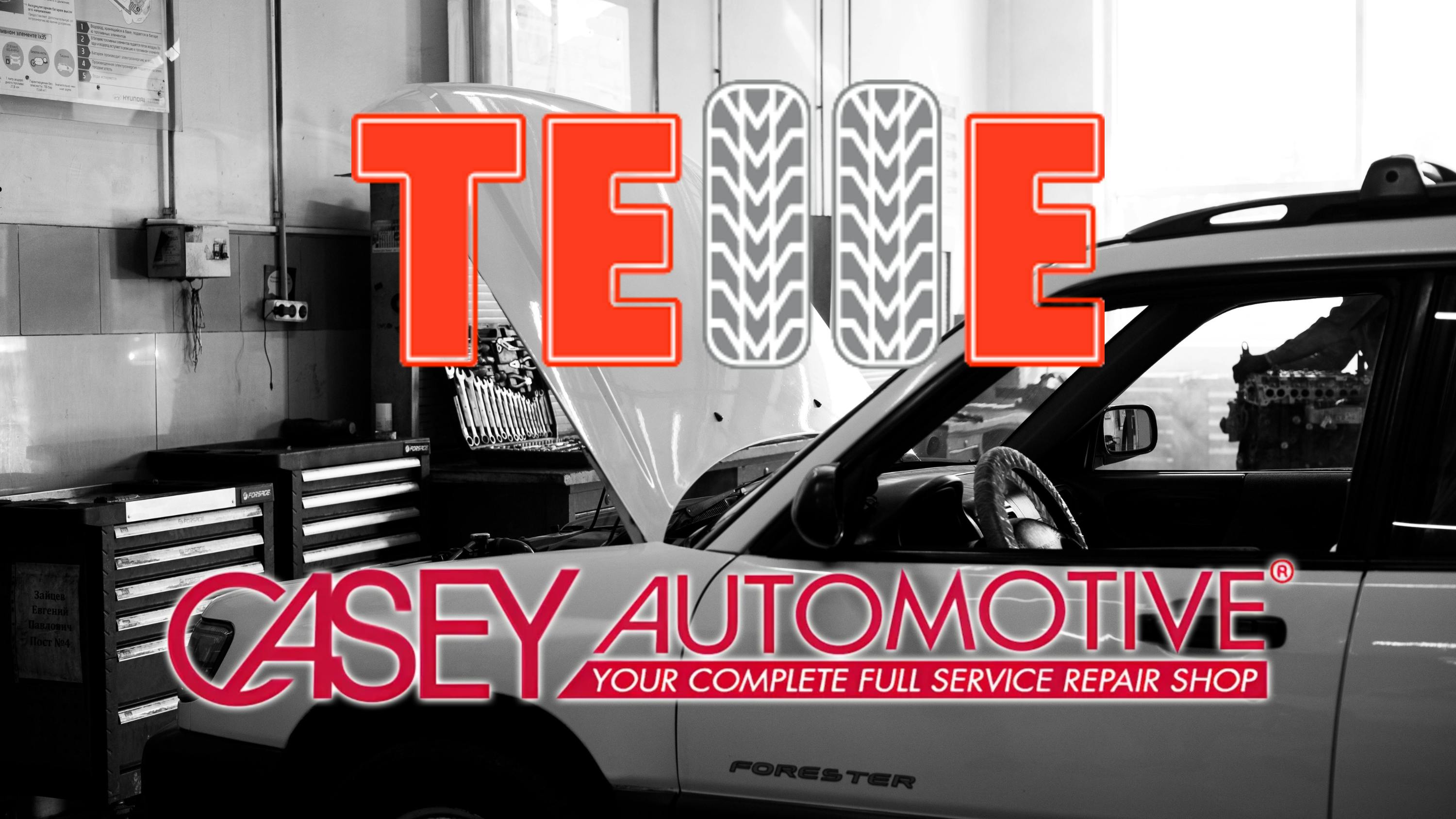 a black and white photo of a car in an auto shop with the logos for Telle Tire and Casey's Automotive overlaid