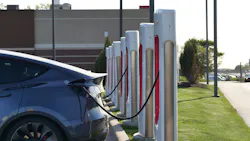 a tesla car charging at a tesla charging station